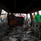 People look at a car burned during clashes between anti-riot police and supporters of Kenyan opposition National Super Alliance (NASA) coalition in the Baba Dogo neighborhood of Nairobi, Kenya, November 19, 2017
